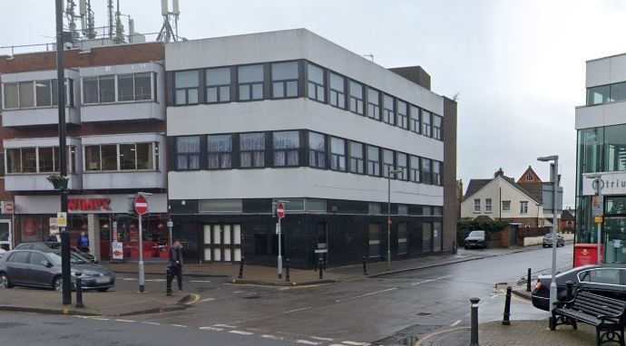 A Google maps image of an empty commercial premises on a street corner
