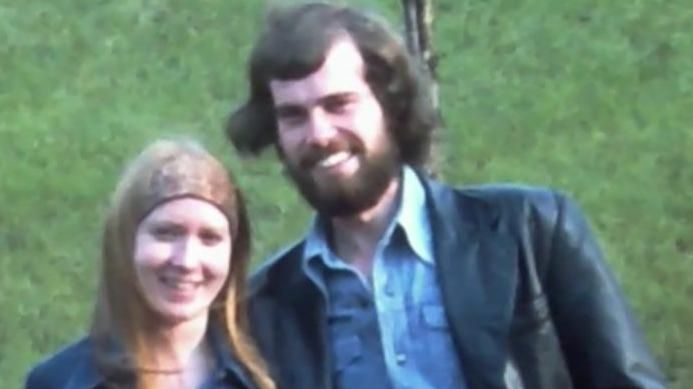 A man and woman pictured in the 1970s in a field