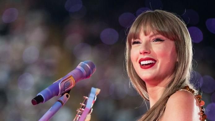 Taylor smiles at the Cardiff crowd