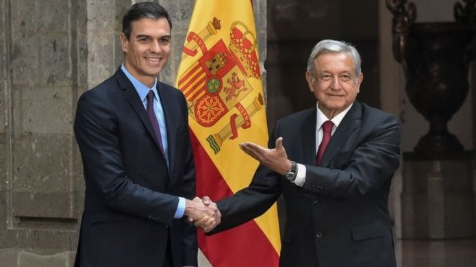 In this file photo taken on January 30, 2019 Mexico's President Andres Manuel Lopez Obrador (R) welcomes Spain's Prime Minister Pedro Sánchez at the National Palace in Mexico City.