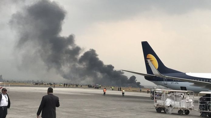 Photo showing smoke rising from the airport runway