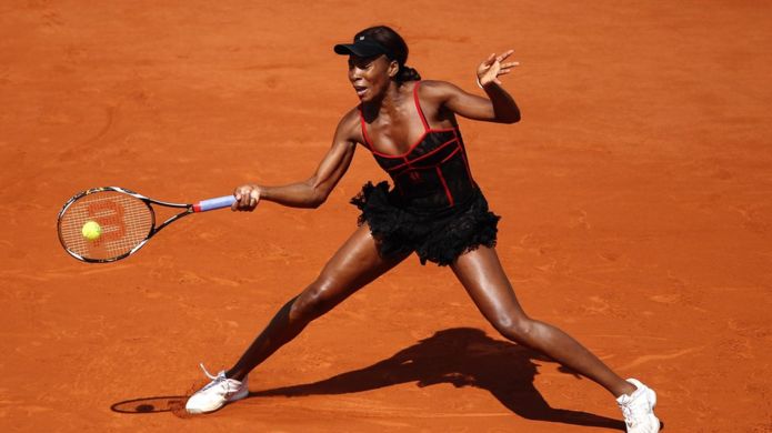 Venus Williams sports a black and red lacy dress at the French Open in Paris in 2010.