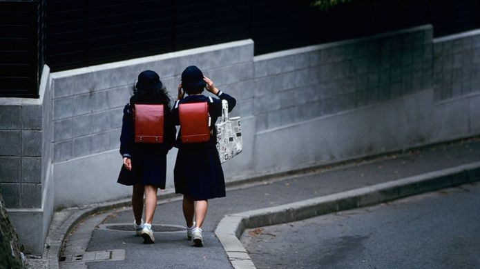 Two girls in school uniform