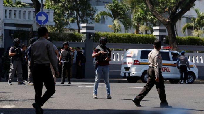 Police outside the police office following the blast