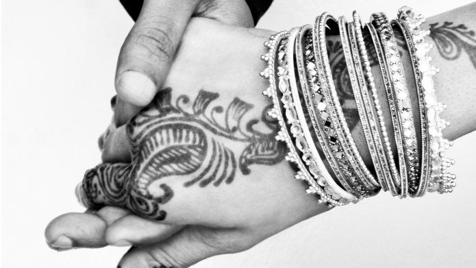 Man and woman's hands on wedding day