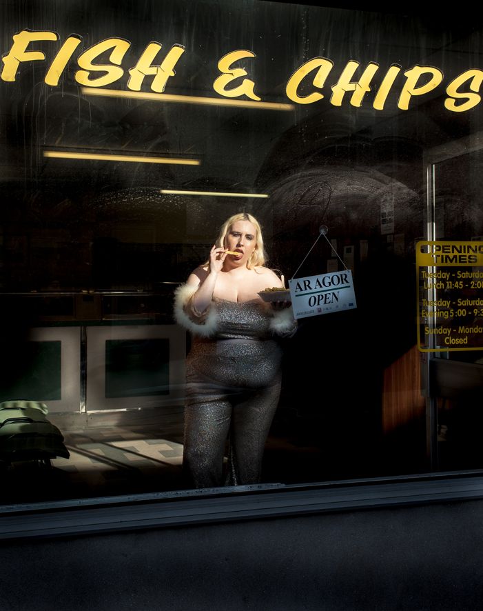 A photograph of a woman in a fish and chip shop in Abercynon