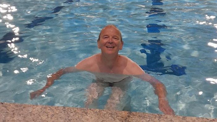 John Boardman in a swimming pool