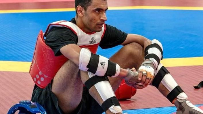 Farzad Mansouri sits recovering after a sparring session