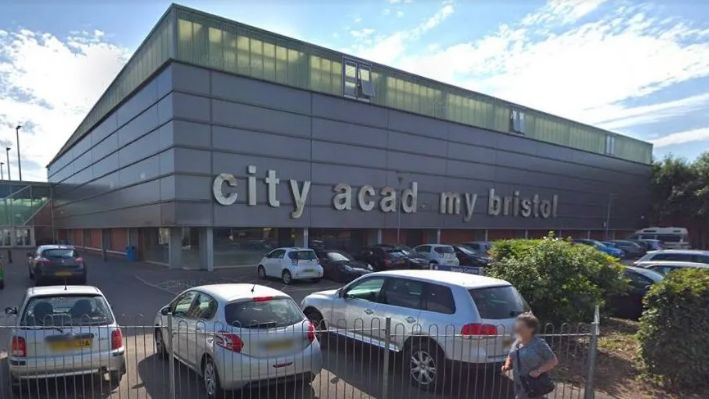 Entrance to City Academy in Bristol with cars outside