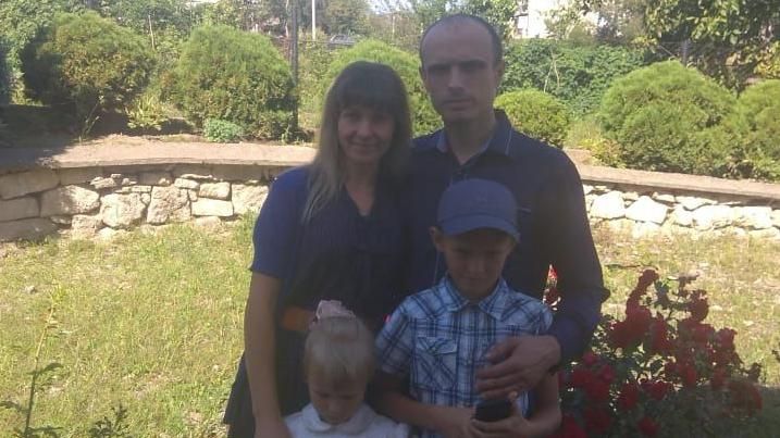 Sergey and his family in a garden
