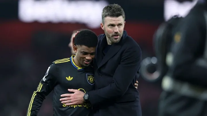 Manchester United winger Amad Diallo with head coach Michael Carrick