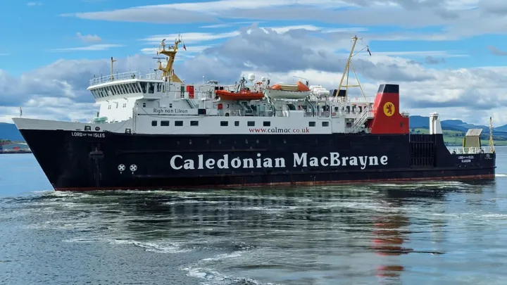 CalMac ferry navigating a rugged Scottish coastline
