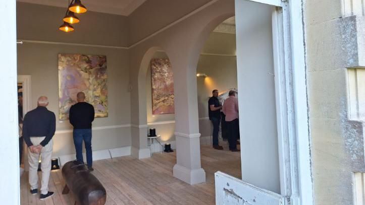 Visitors in the new art gallery in Burderop House
