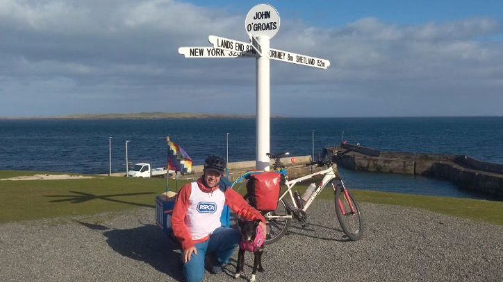 John Vincent under the John O'Groats sign