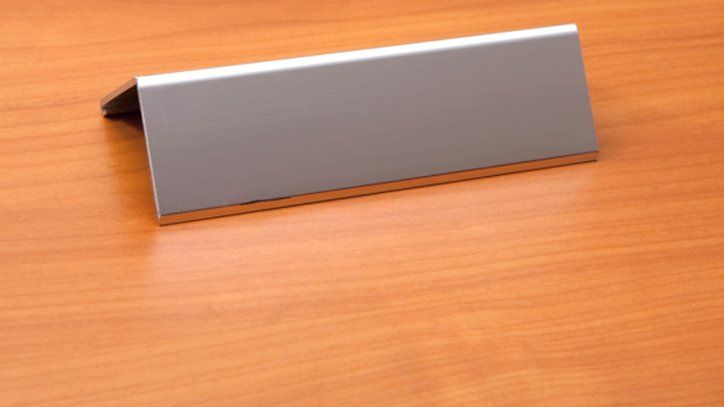 Blank name plate on a desk