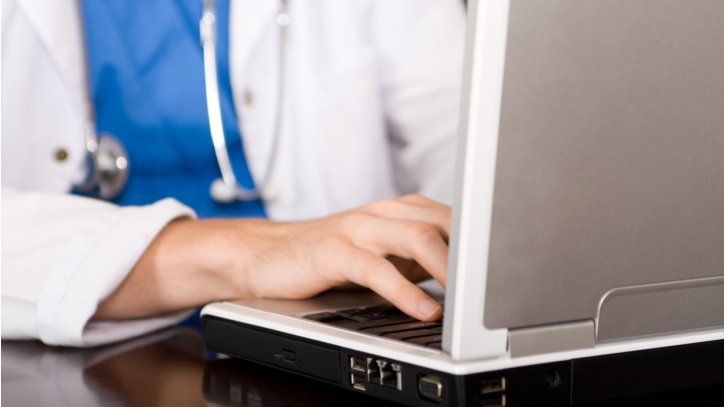 NHS worker on computer