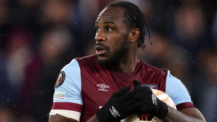 West Ham striker Michail Antonio holds a football to his chest