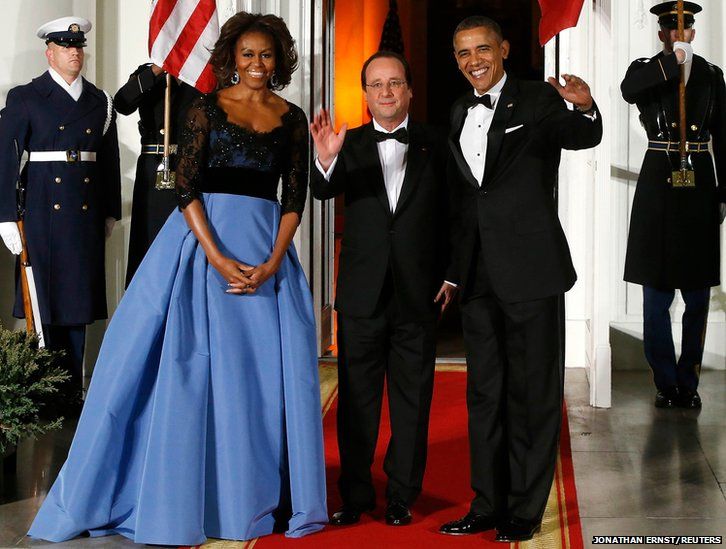 President Barack Obama and his wife Michelle greet French President Francois Hollande (centre) as he arrives for a State Dinner in his honour at the White House in Washington