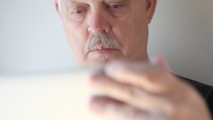 Older man using laptop