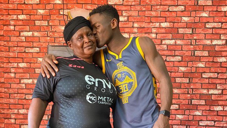 Augustus Kargbo kisses his mother Fatmata Kanu