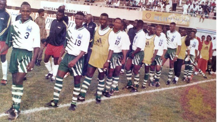 Ernest Kamara (19) second in line walking out to play for Sierra Leone against The Gambia in 2001