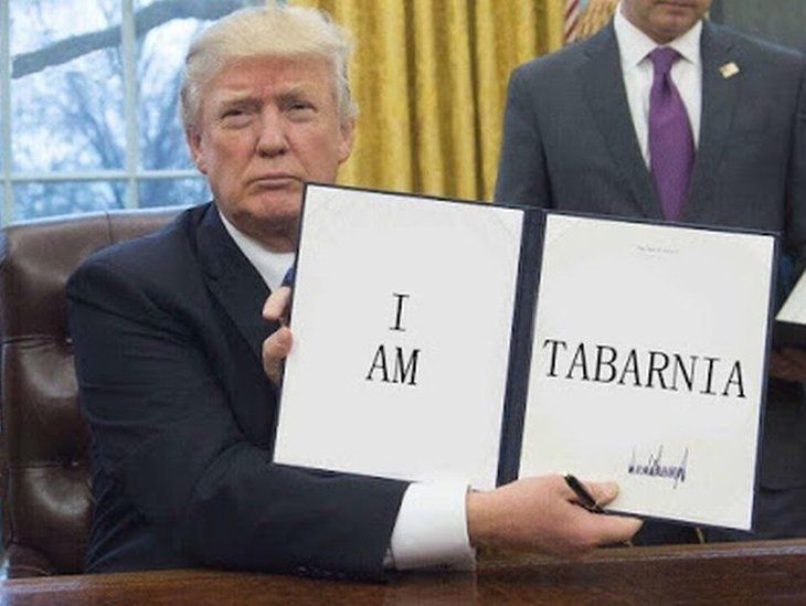 Donald Trump holding a sign that reads 'I am Tabarnia'