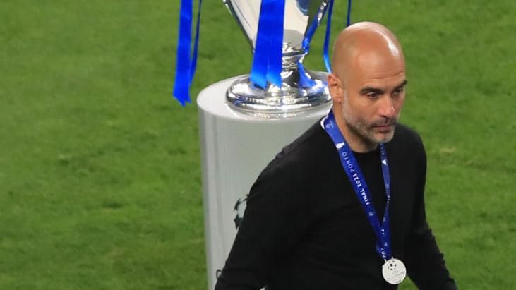 Pep Guardiola receives a runners-up medal after the Champions League final