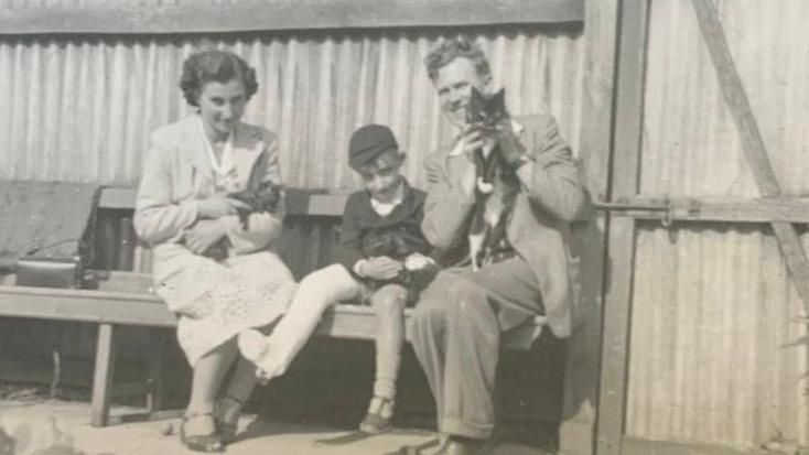 An old photograph of Doris Maslen in her younger years, with her family