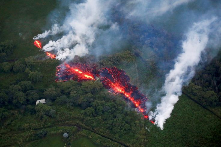 An aerial photo of a fissure with lava erupting