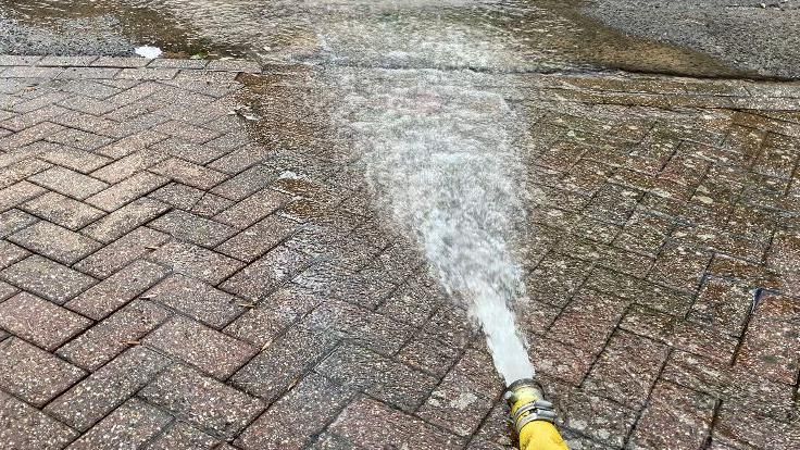 Water being pumped away from Mr and Mrs Damon's home