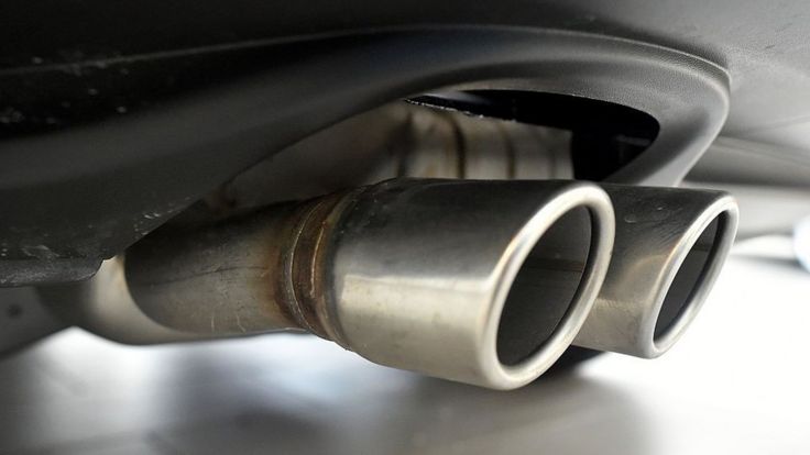 Exhaust pipes are seen on a Volkswagen vehicle at an auto dealership in San Francisco, California on March 24, 2016. US judge on Thursday gave Volkswagen until April 21 to come up with a plan to fix some 600,000 cars spewing illegal levels of pollutants due to emissions-cheating software. "This issue of what is to be done with these cars must be done by that date," US District Court Judge Charles Breyer told attorneys of the German automaker during a status hearing. / AFP / Josh Edelson (Photo credit should read JOSH EDELSON/AFP/Getty Images)