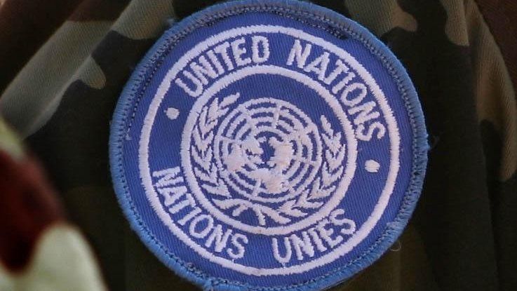 File photo dated 5/2/09 of a close-up view of the new UN badge as Irish Troops rehearse the switching command of the Chad peace enforcement mission from the EU to UN at their Barracks in Camp Ciara, Chad
