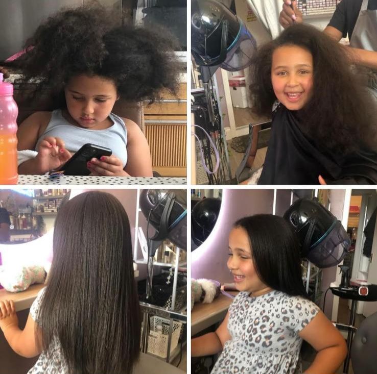 A child getting her hair blow-dried 