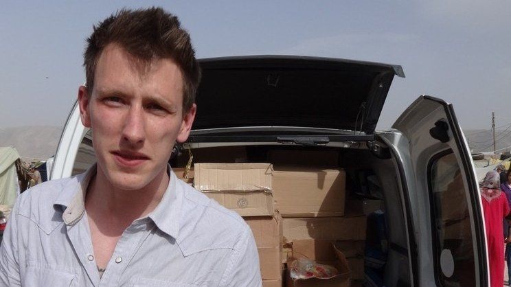 File photo: Peter Kassig in front of a truck somewhere along the Syrian border between late 2012 and autumn 2013