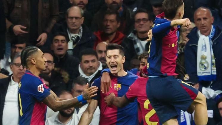 Robert Lewandowski celebrates scoring against Real Madrid 