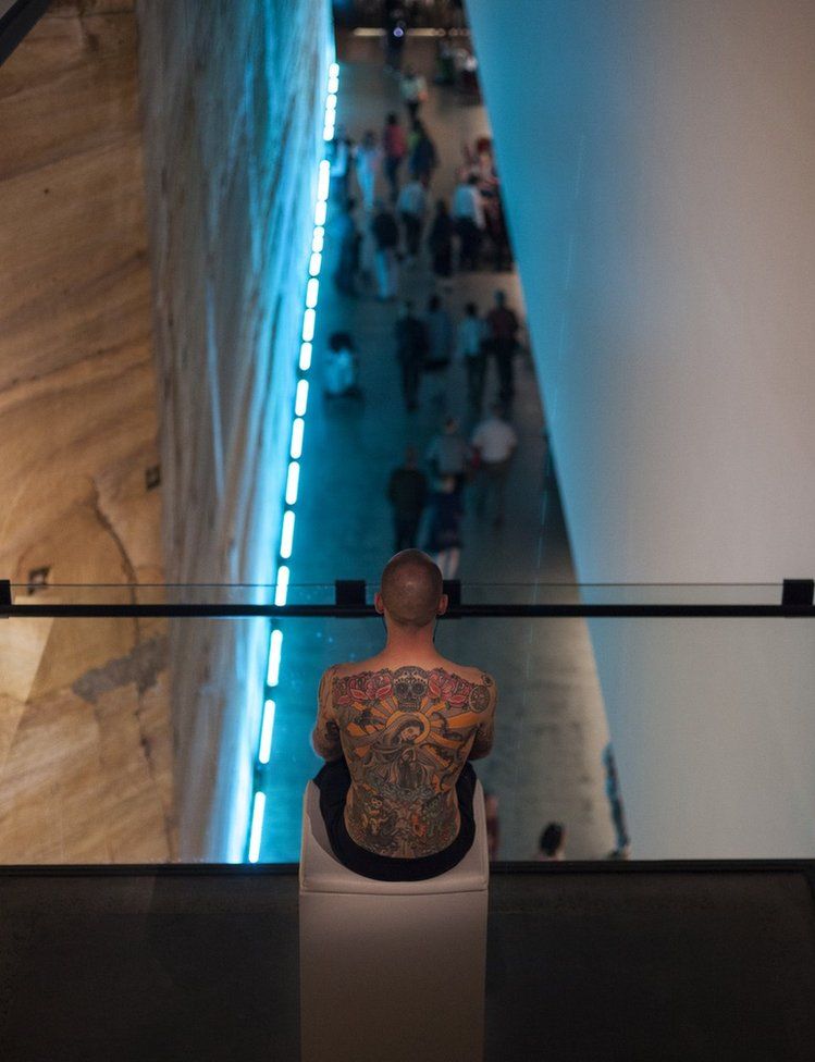 Tim Steiner models his tattoo at mona in Hobart, Australia