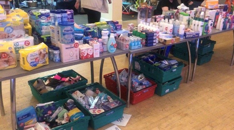 Tables filled with nappies, baby food and hygiene products