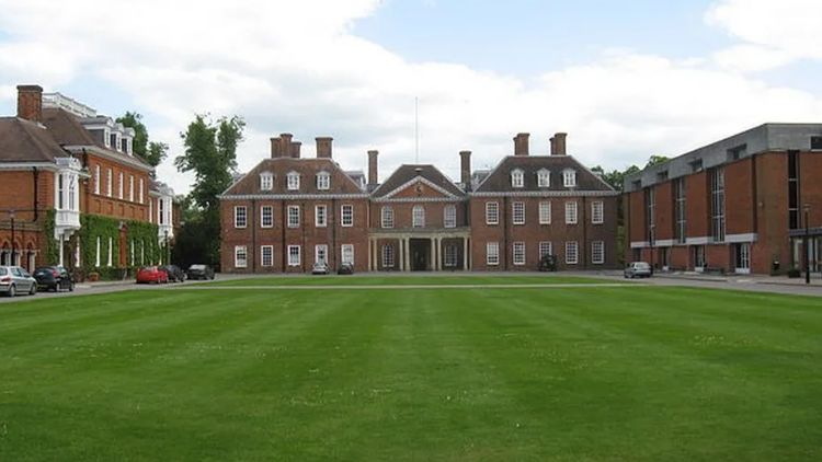 Marlborough College, three-storey red brick buildings behind a large lawn