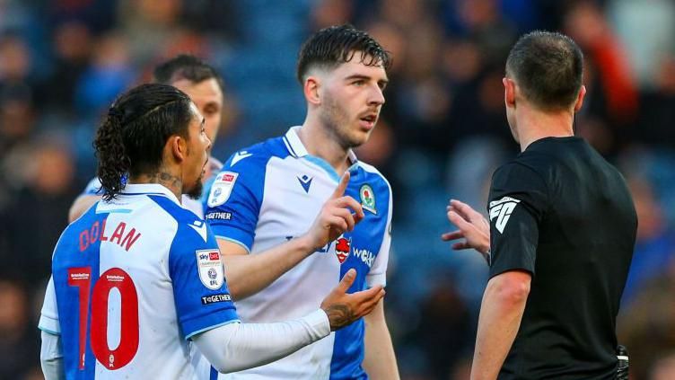 Blackburn Rovers' Joseph Rankin-Costello complains to referee Stuart Attwell during the Sky Bet Championship match between Blackburn Rovers and Ipswich Town at Ewood Park on March 29, 2024 in Blackburn, England.