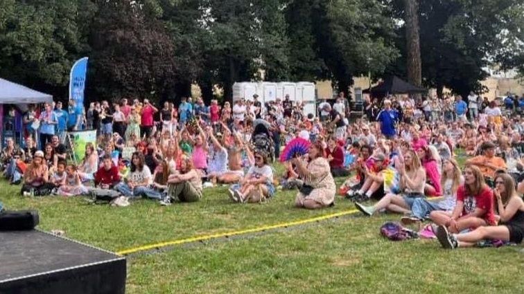 People gathered in front of the stage at Chippenham Pride 2023