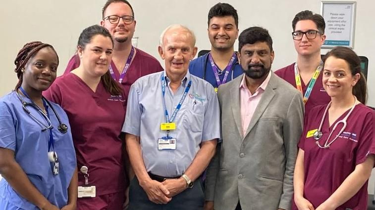 Staff from the emergency department and intensive care unit with Bob Smyth and Dr Srinivas Vinjamuri (middle)