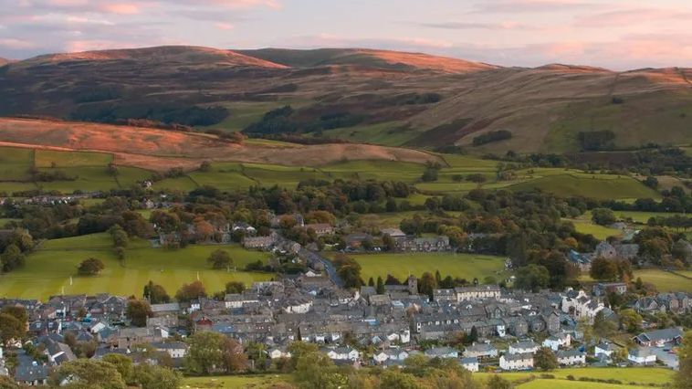 Aerial photo of a town and hills in Cumbria