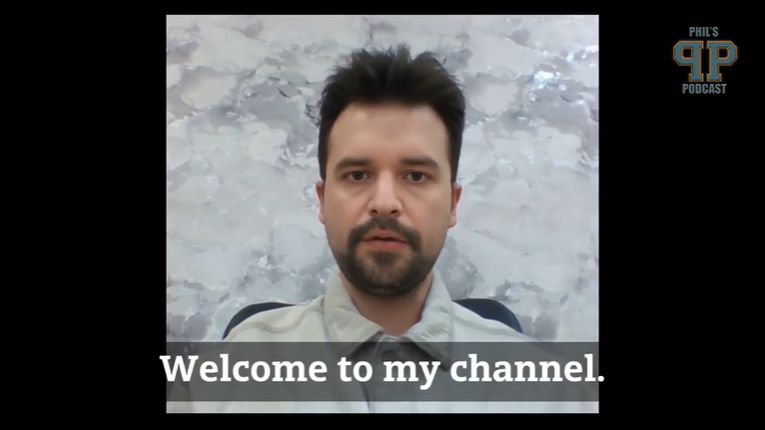 A man in front of a plain backdrop with the subtitle "Welcome to my channel"