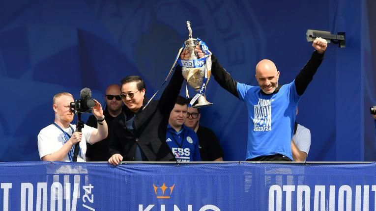 Leicester chairman Aiyawatt Srivaddhanaprabha lifting the Championship trophy with manager Enzo Maresca