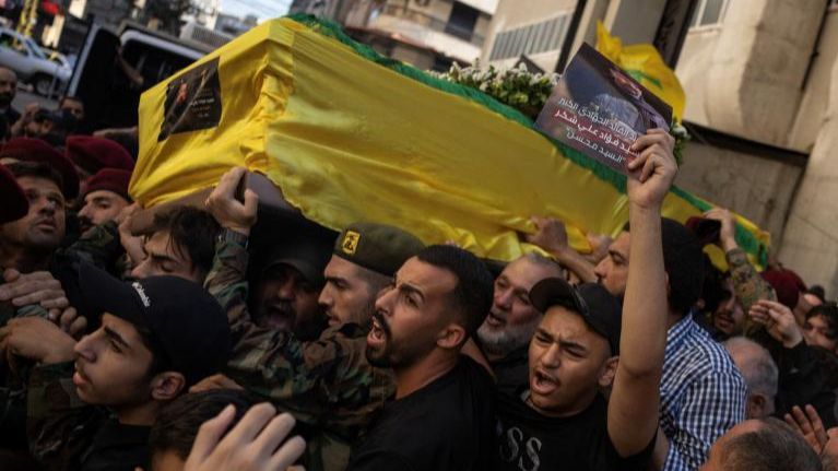 Mourners carry the coffin of Fuad Shukr, a senior Hezbollah commander who was killed in an Israeli strike on Tuesday, during his funeral in Beirut's southern suburbs, Lebanon August 1, 2024.