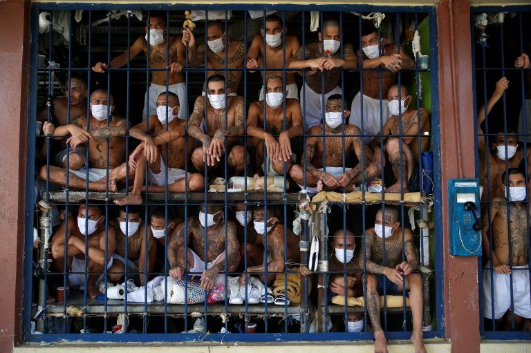 Prisoners are seen crowded together in a cell in El Salvador