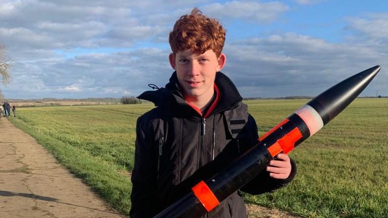 Teenager with rocket