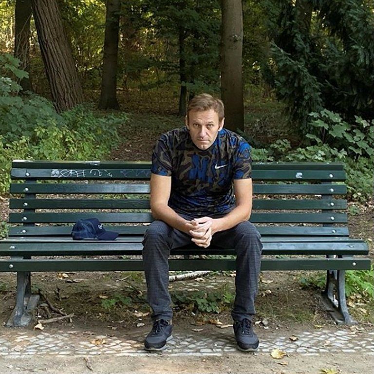 Navalny sits on a park bench in a photo uploaded to his Instagram account