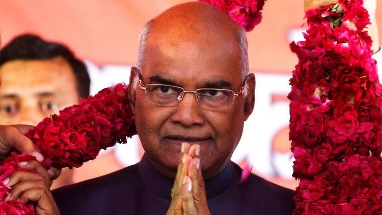 Supporters of Ram Nath Kovind, nominated presidential candidate of Indiaâ€™s ruling Bharatiya Janata Party (BJP), present him with a garland during a welcoming ceremony as part of his nation-wide tour, in Ahmedabad, India, July 15, 2017