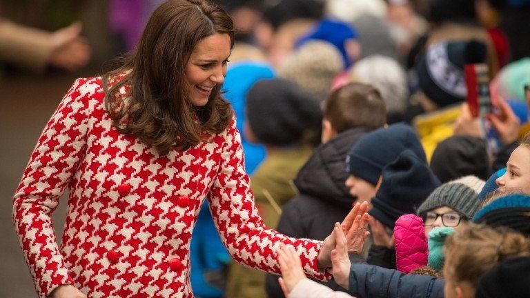 The duchess high-fives youngsters